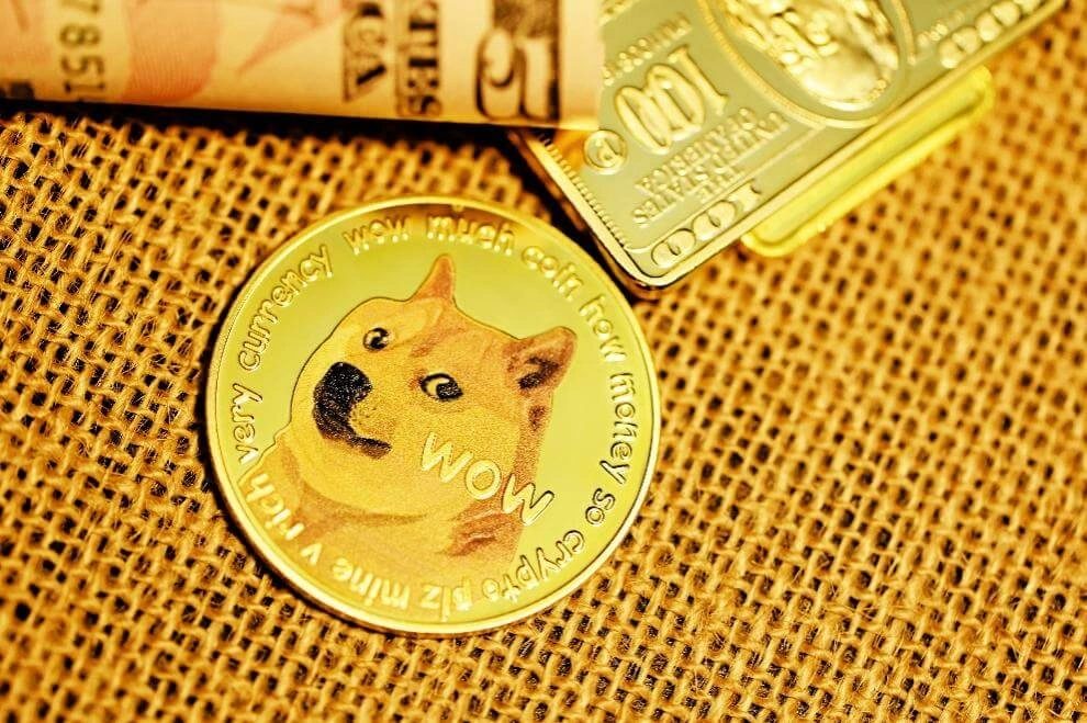 Gold Dogecoin token placed beside dollar notes and a gold bar